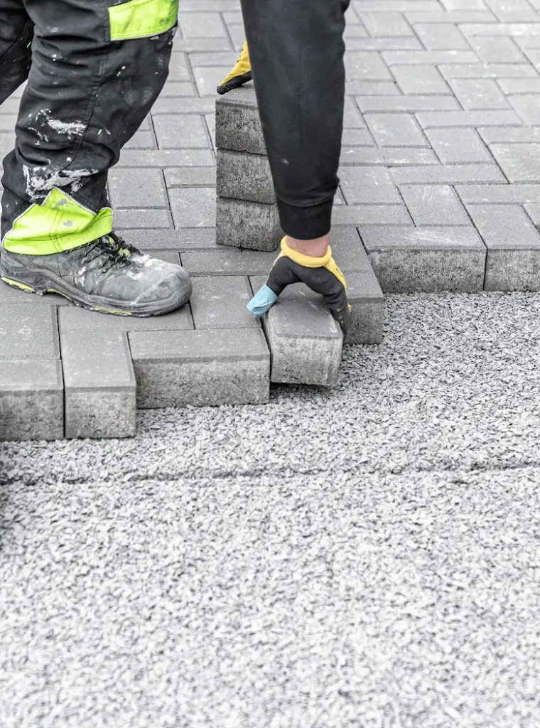 laying-interlocking-pavers-during-the-construction-2023-11-27-05-10-03-utc