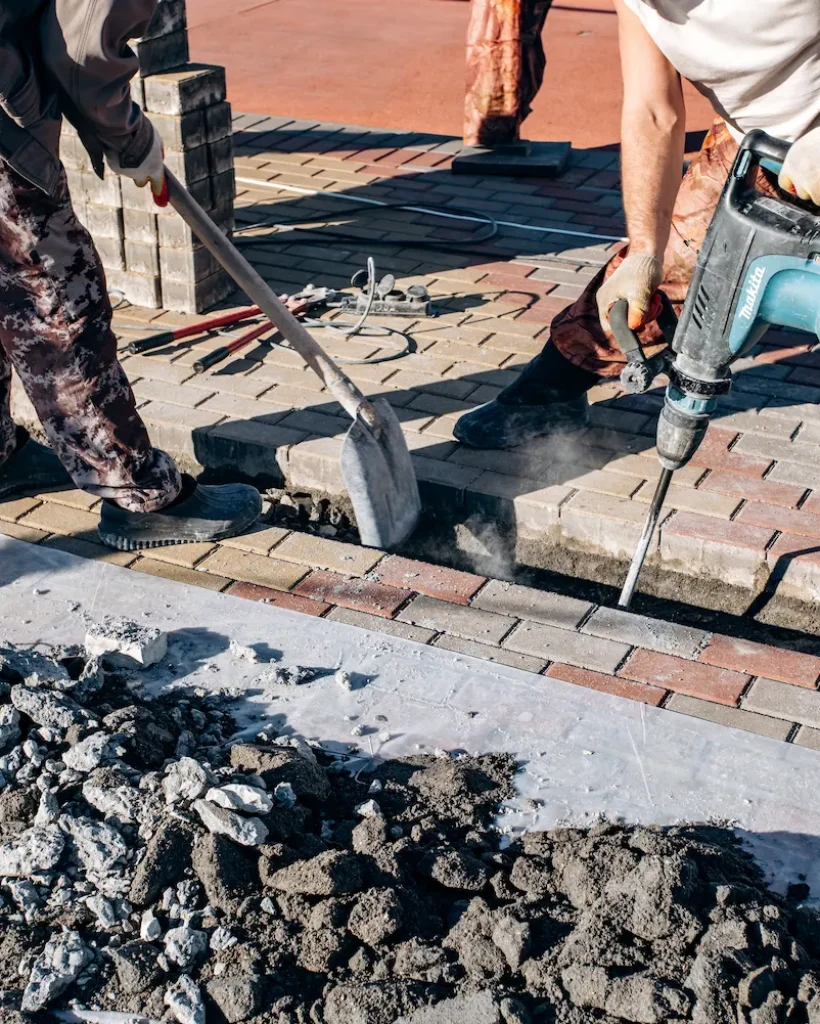 workers-laid-paving-slabs-two-workers-lay-paving-2023-11-27-04-53-17-utc